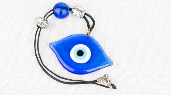A broken Evil Eye amulet, signifying absorbed negative energy.