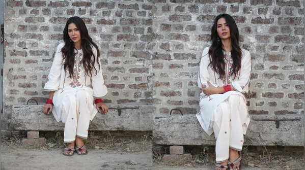 Sonam Bajwa in a stylish white floral suit.