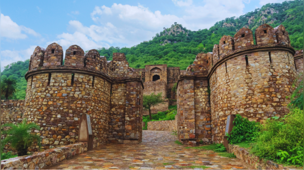 Sun setting over the deserted Bhangarh Fort in Rajasthan.