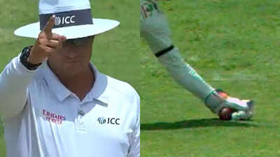 Umpire reviews a play during the WI vs AUS Test