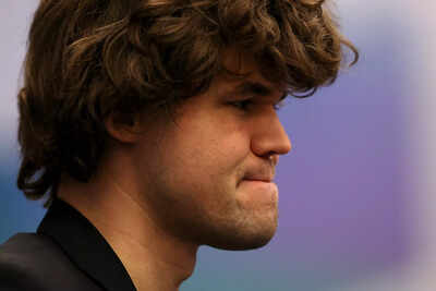 Magnus Carlsen contemplates his next move during a chess match.