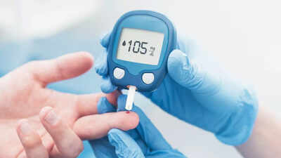 Person checking blood sugar level in the morning
